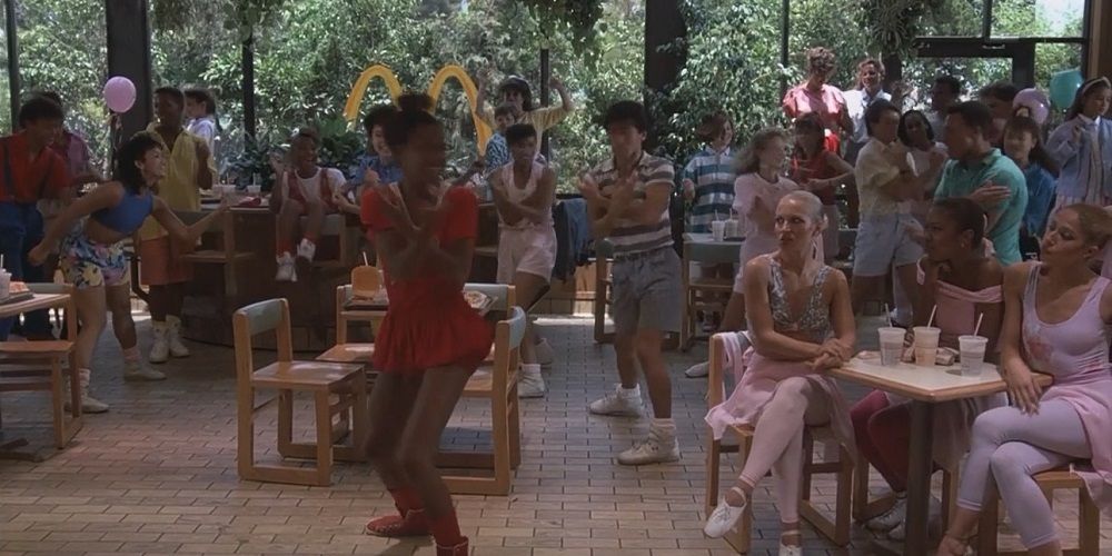 Characters dance inside a McDonalds in Mac and Me