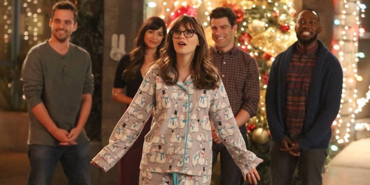 Jess in her Christmas pajamas marveling at the Christmas lights in New Girl