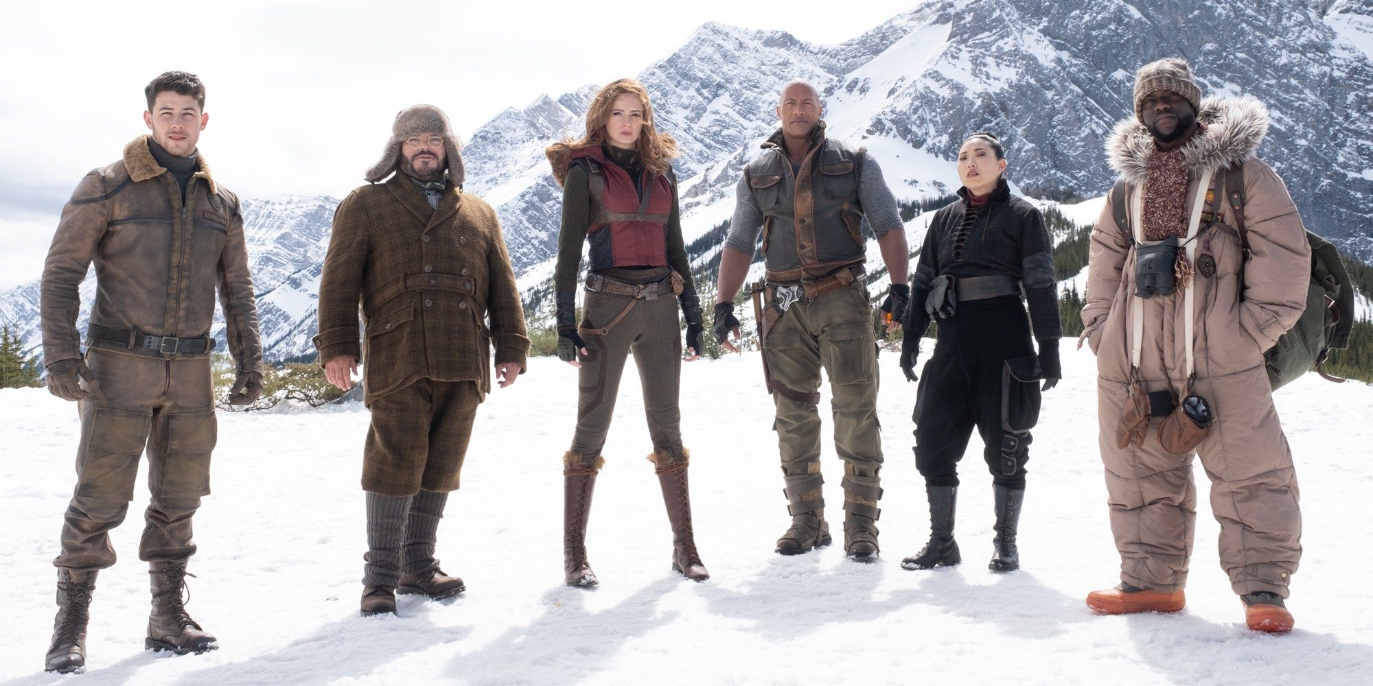 Characters on snowy mountain in Jumanji The Next Level