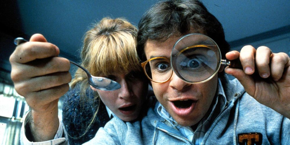 Rick Moranis looks through a magnifying glass in Honey, I Shrunk The Kids