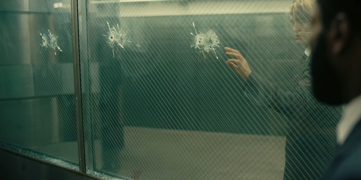 Robert Pattinson and Bullet Holes Glass in Tenet