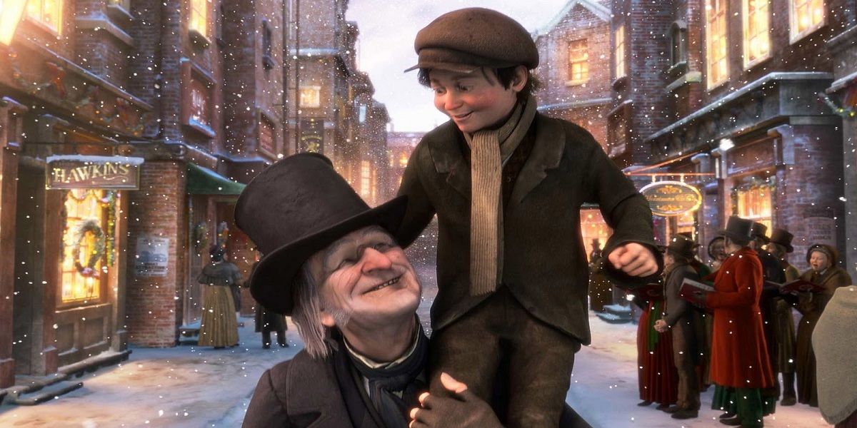 Scrooge holding Tiny Tim in A Christmas Carol