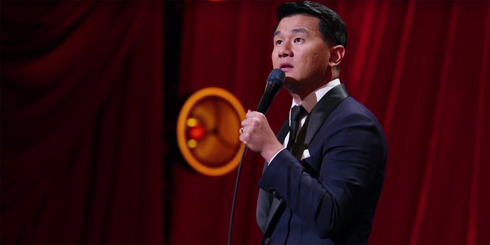 Ronny Chieng doing standup comedy.