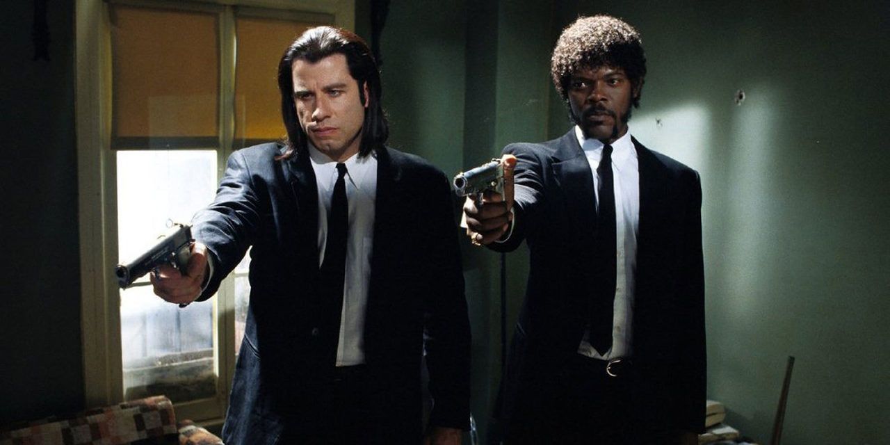 Vincent and Jules pointing guns at someone not pictured in Pulp Fiction