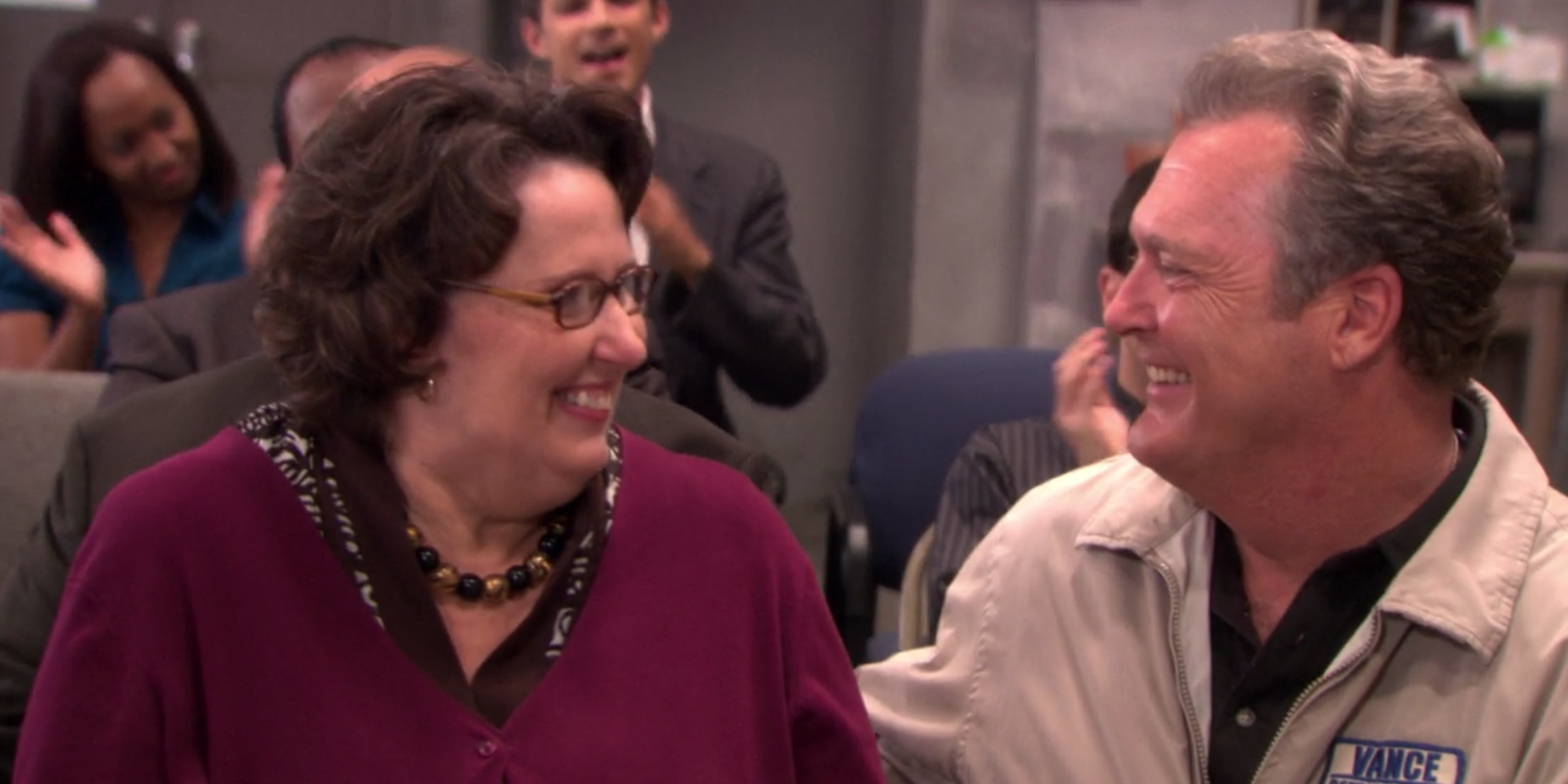 Phyllis and Bob smiling at each other in The Office