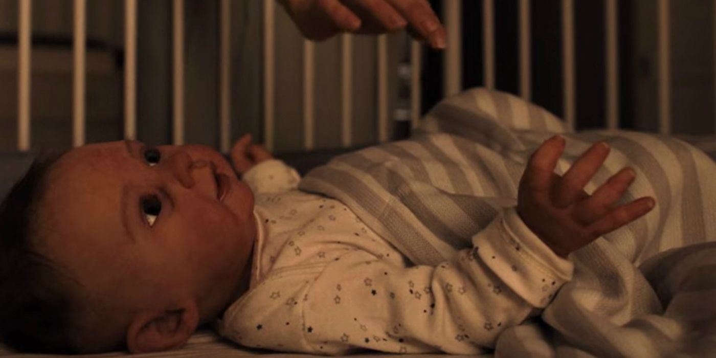 A close up of baby Jericho in his crib, which is actually a fake baby