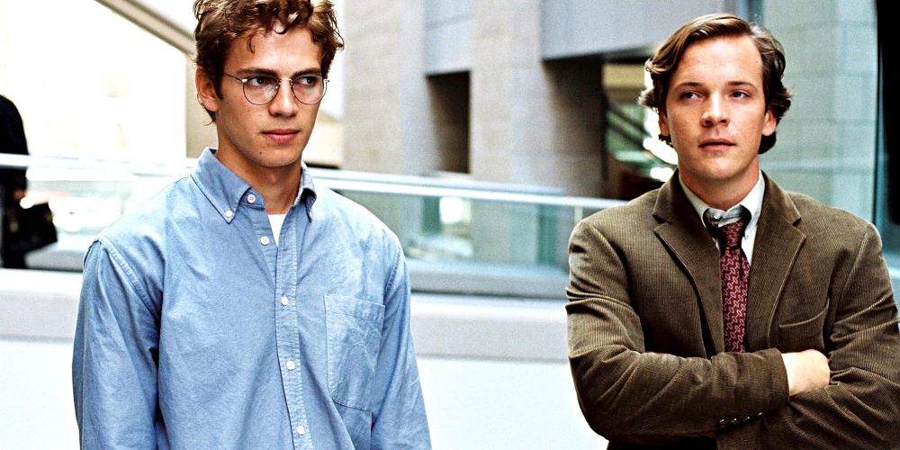 Hayden Christensen and Peter Sarsgaard walk outside office buildings in Shattered Glass