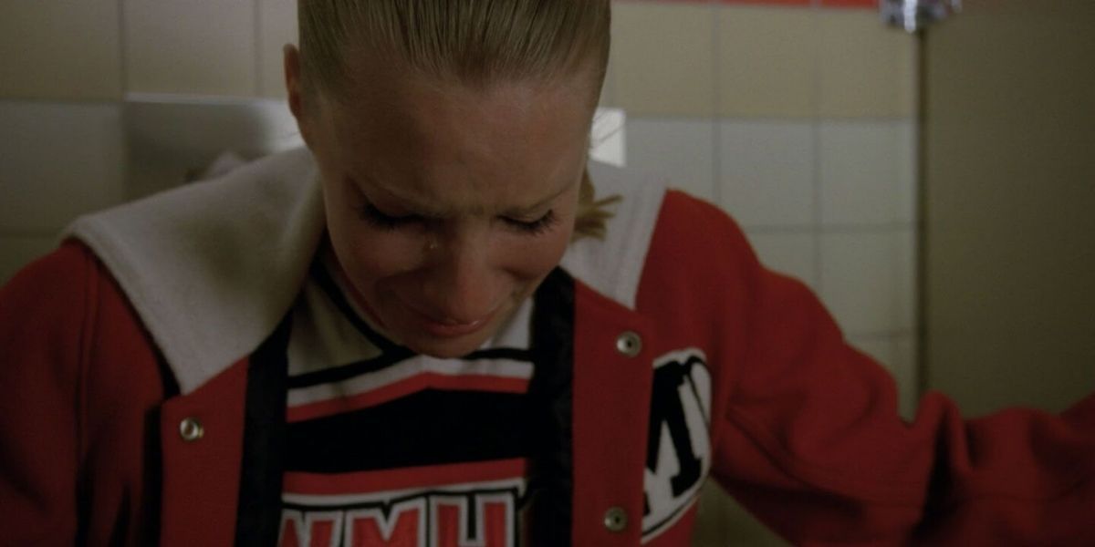 Brittany crying inside a bathroom stall in Glee.