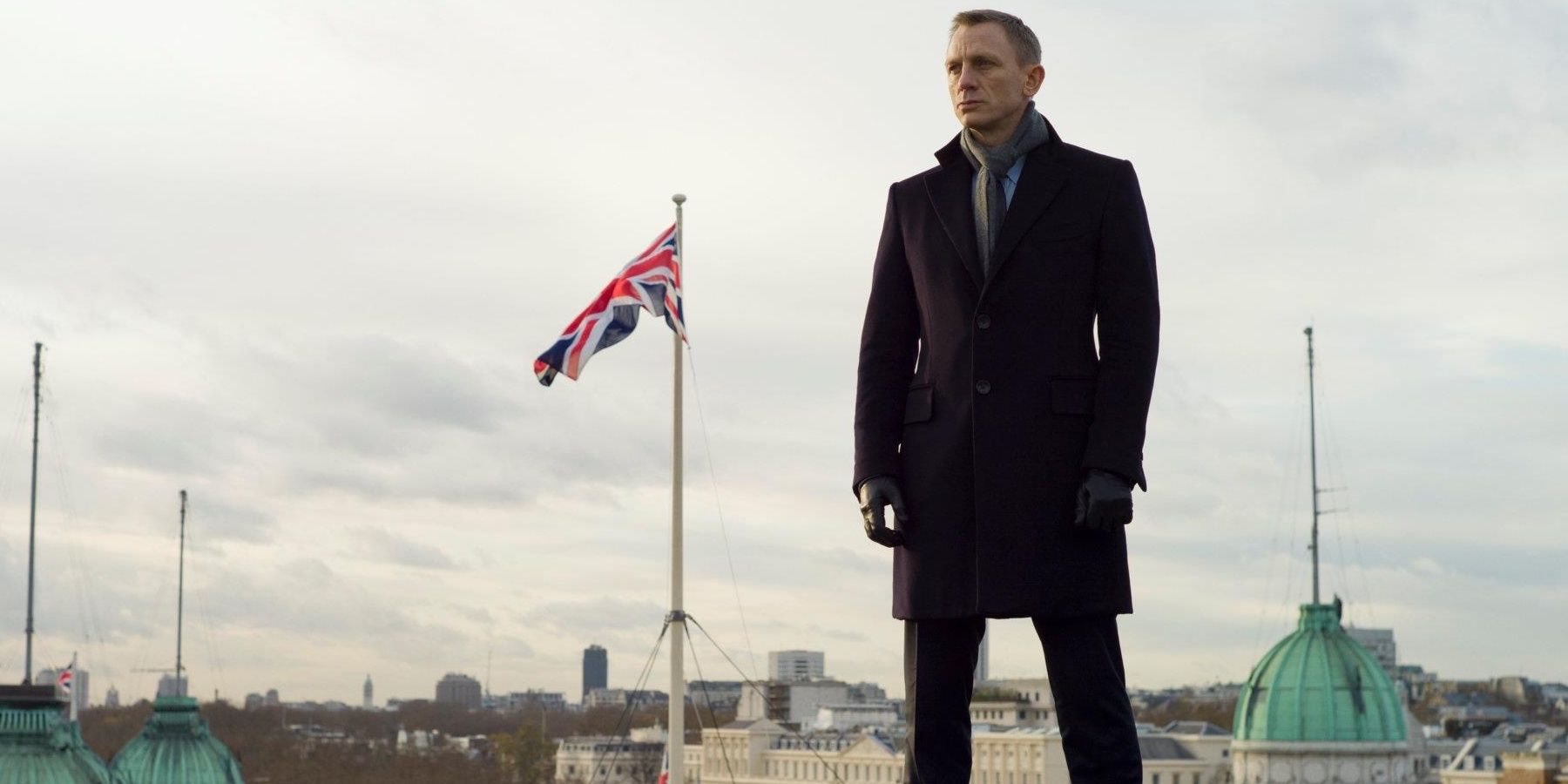Daniel Craig as James Bond in Skyfall, standing and staring to his right