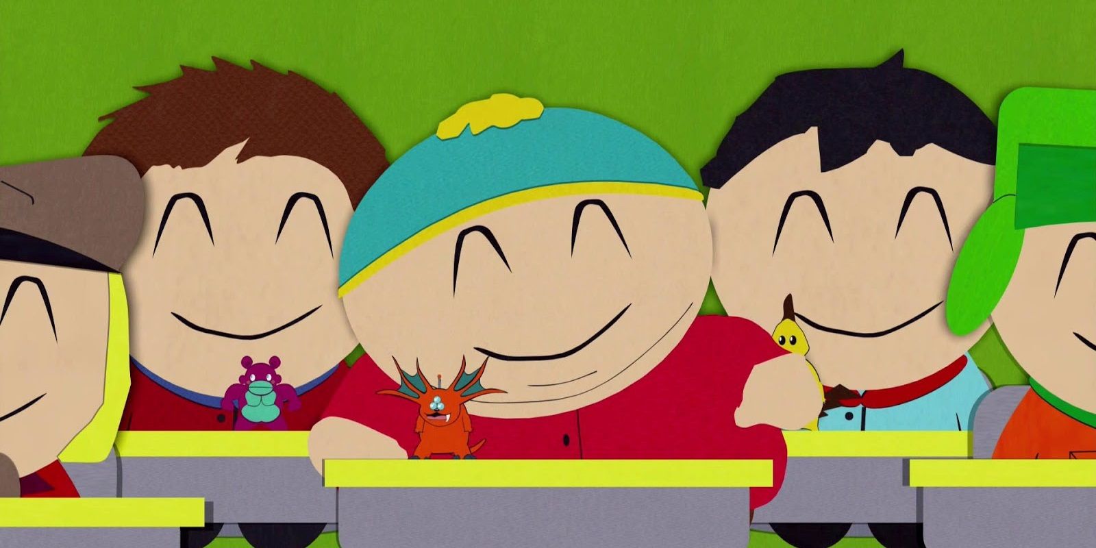 Kyle, Cartman, Kenny, and Stan smiling in class in South Park.