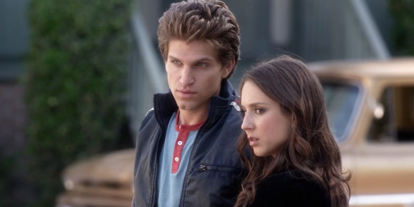 Toby and Spencer standing together outside on Pretty Little Liars