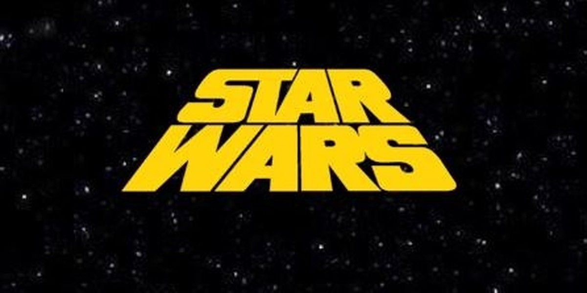 The logo of Star Wars against a starry sky