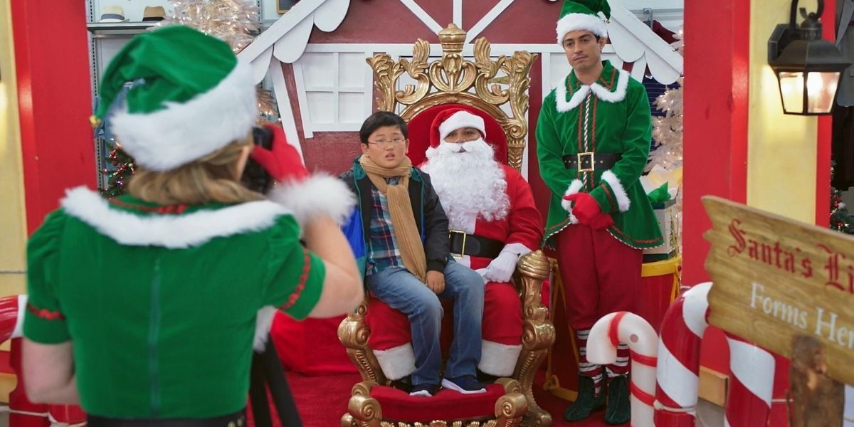 Garrett dressed as Santa and Jonah dressed as an elf in Superstore