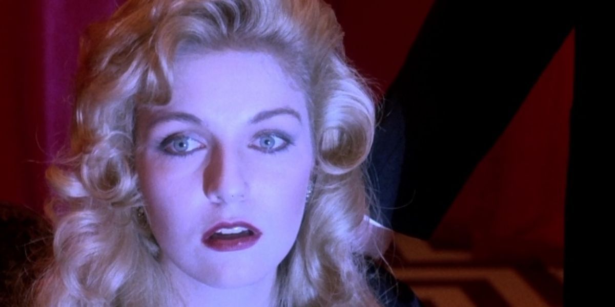 Laura Palmer looks on in shock with a bright light on her face from Twin Peaks Fire Walk With Me