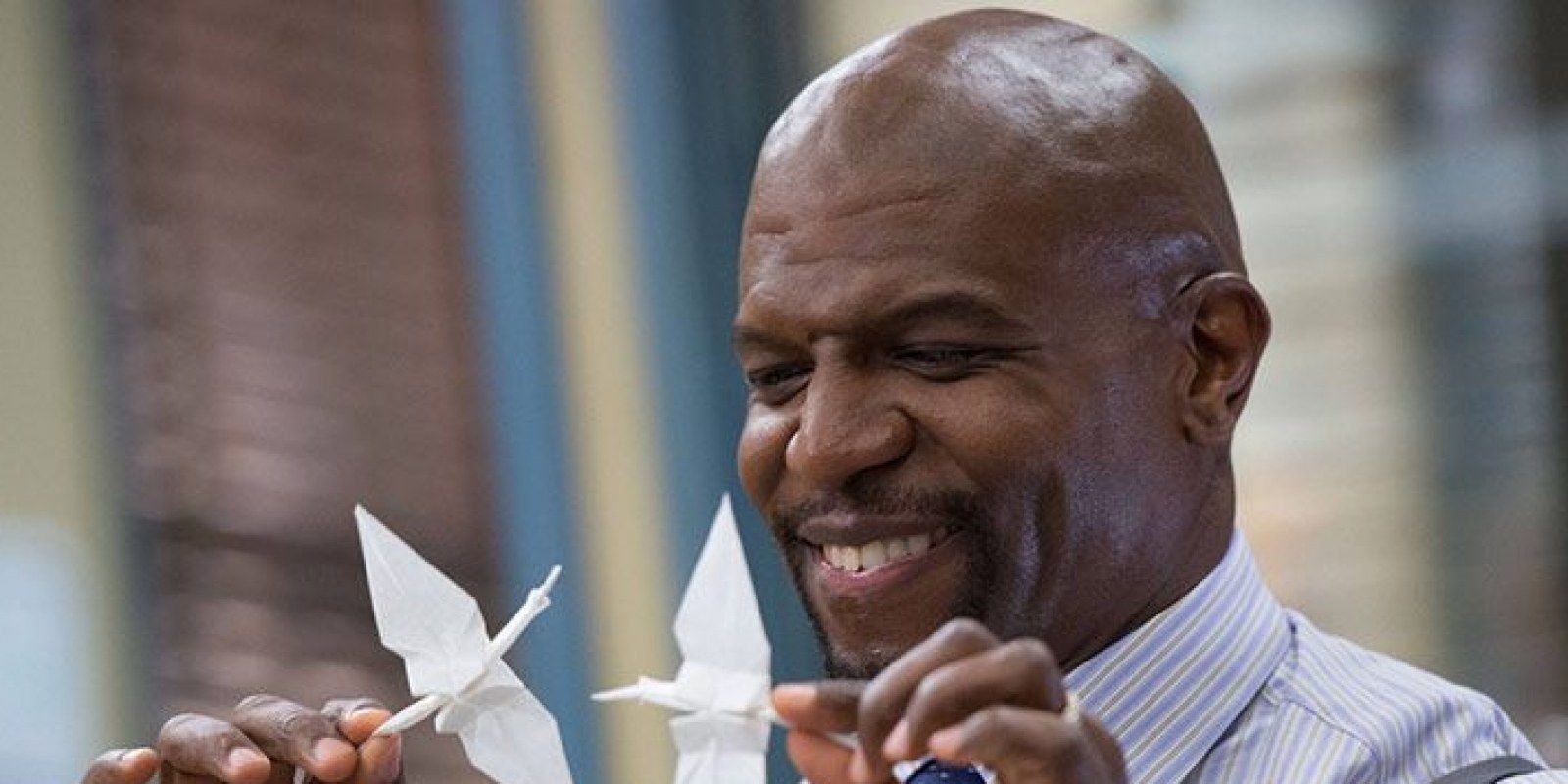 Terry Crews playing with origami
