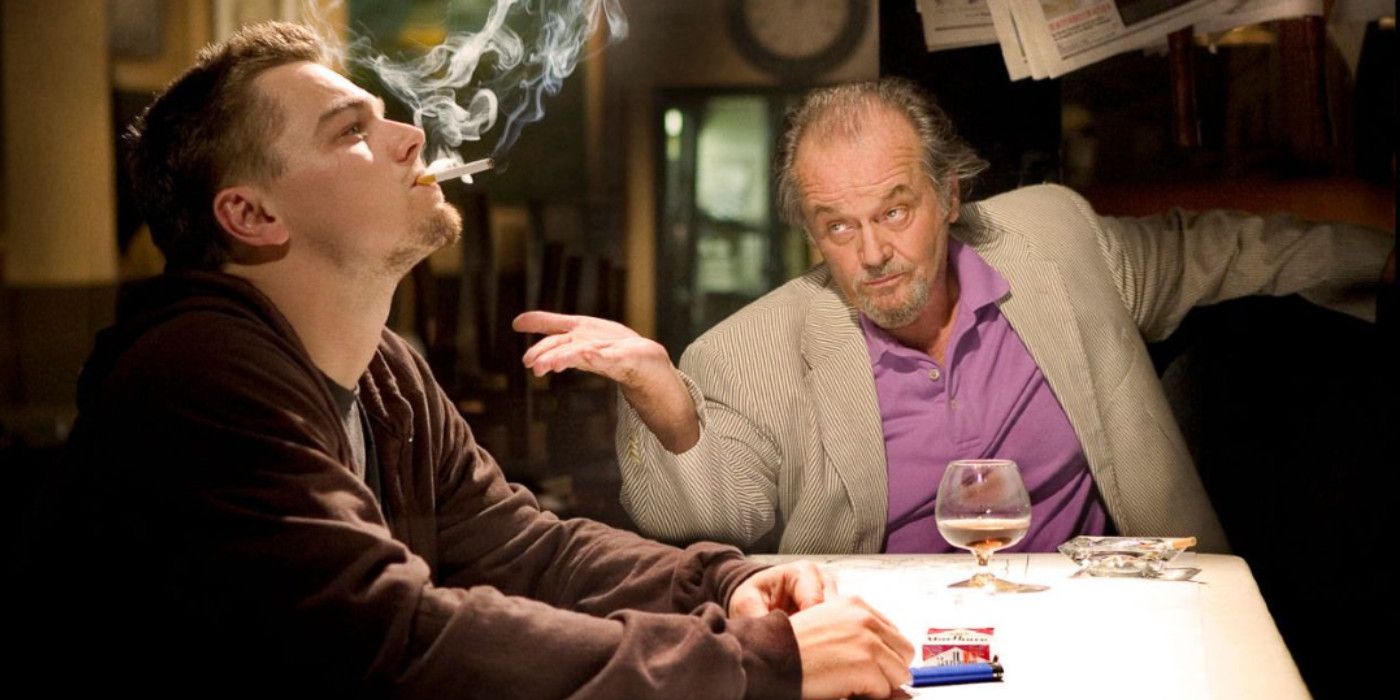 Costello and Billy sit at a table in The Departed