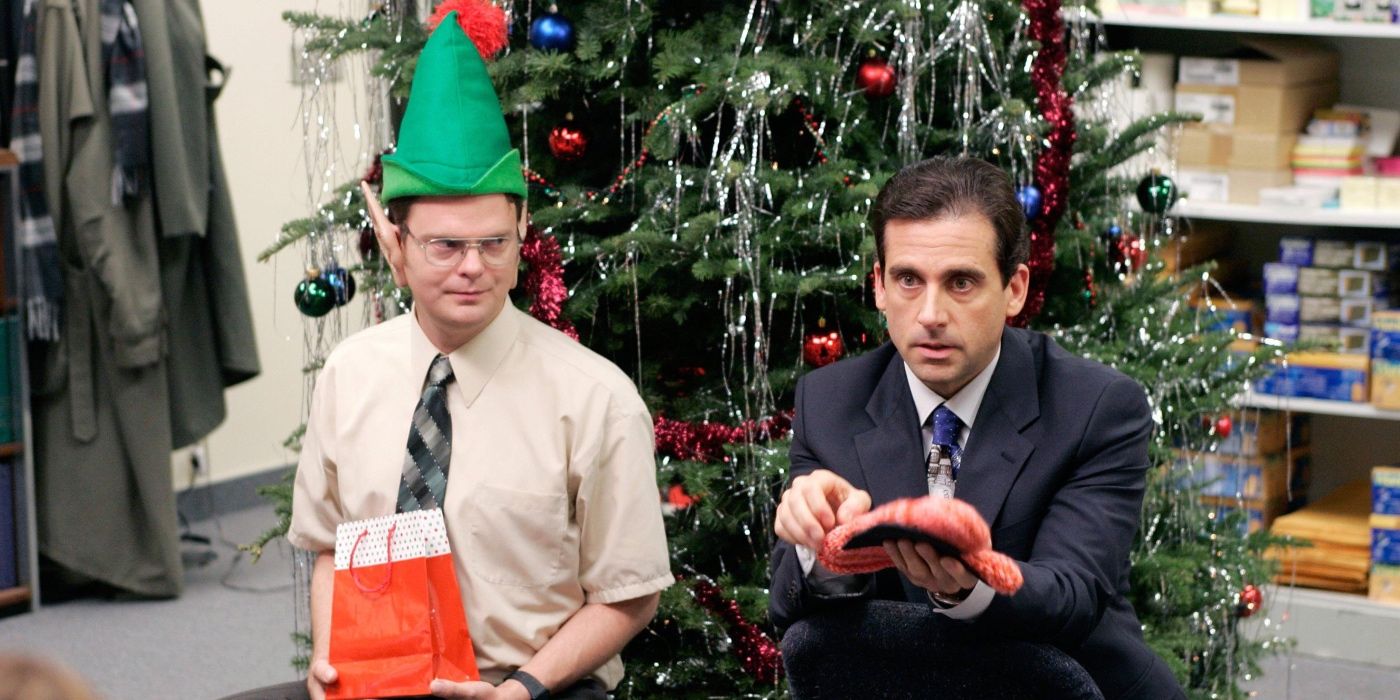 Michael and Dwight by a Christmas tree in The Office episode "Christmas Party"