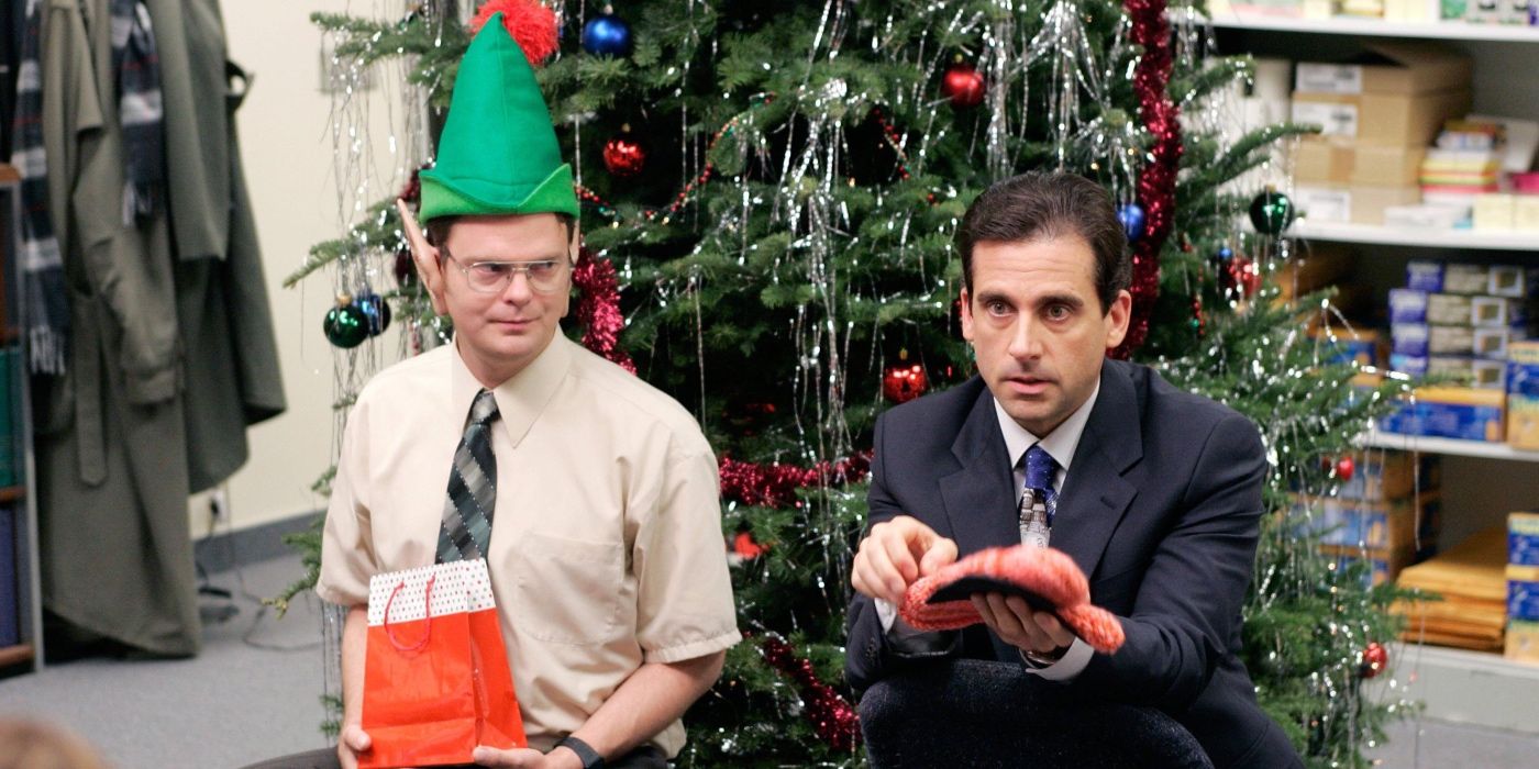 Michael (Steve Carrell) and Dwight (Rainn Wilson) by a Christmas tree in The Office