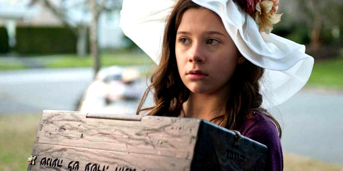A girl holds the Dybbuk Box in The Possession