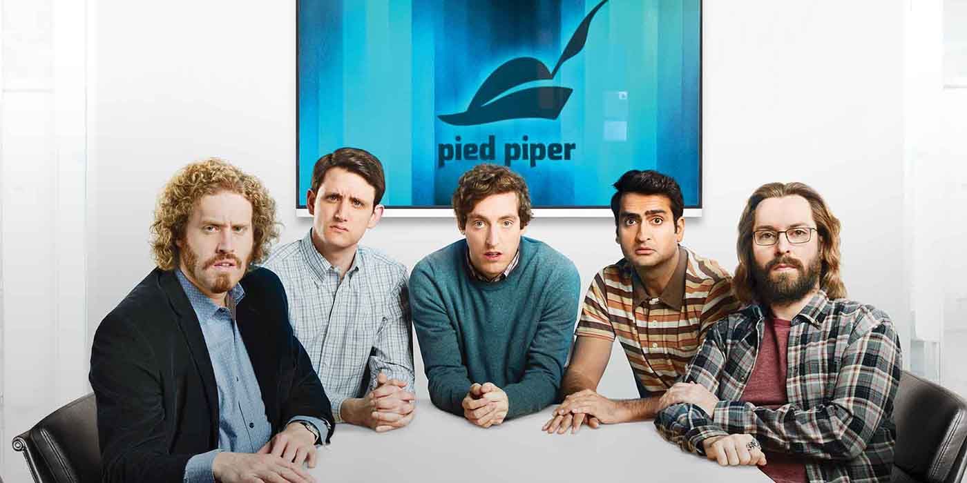 The cast of Silicon Valley.sitting down and looking at the camera