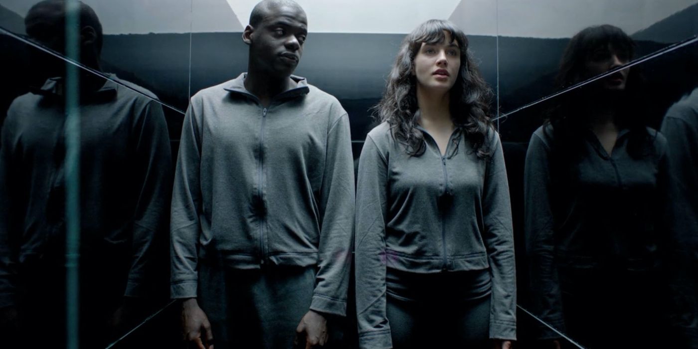 Two people in a small hall in Black Mirror.