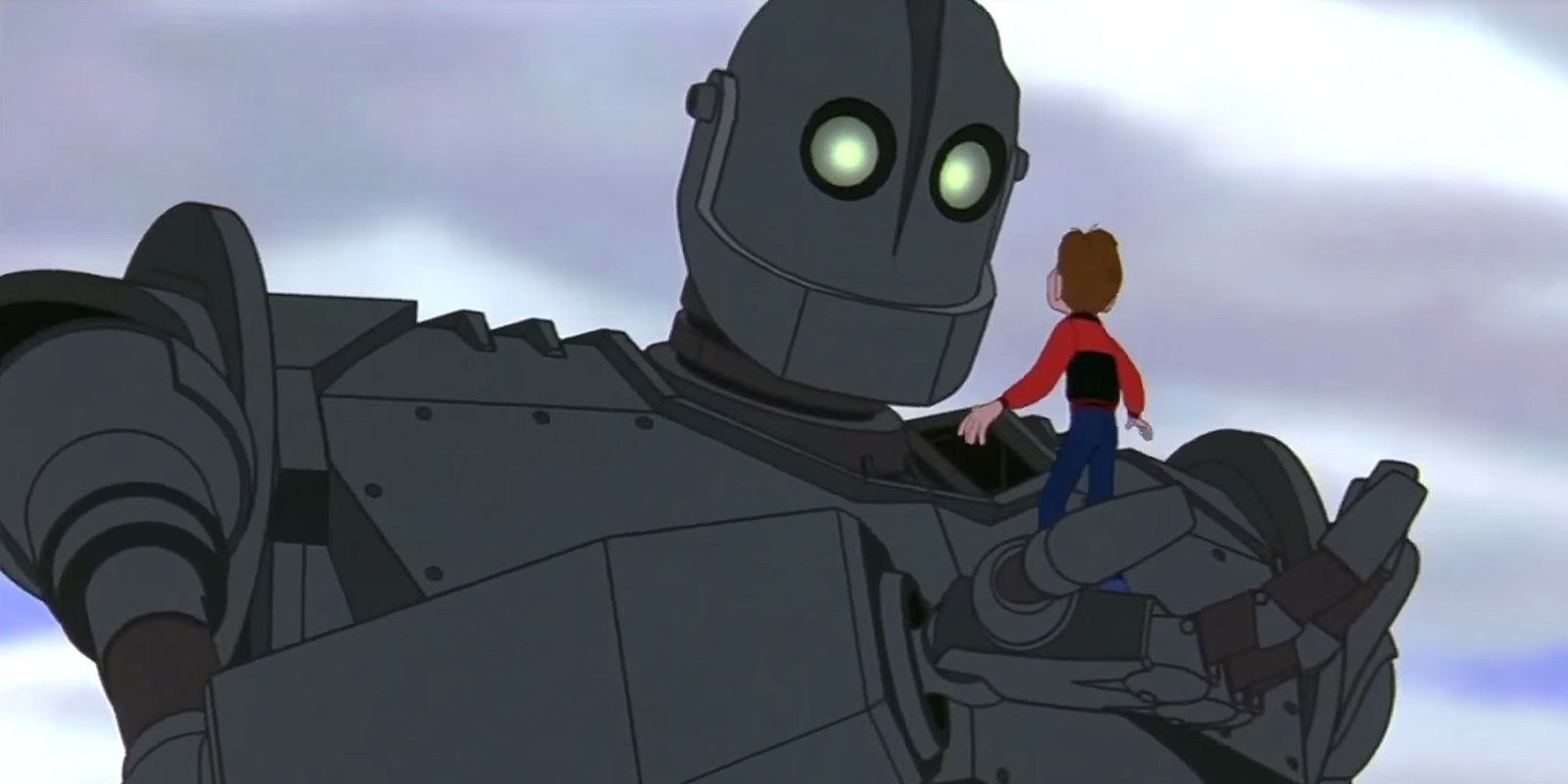 The Iron Giant big robot holding up Hogarth Hughes on his palm 