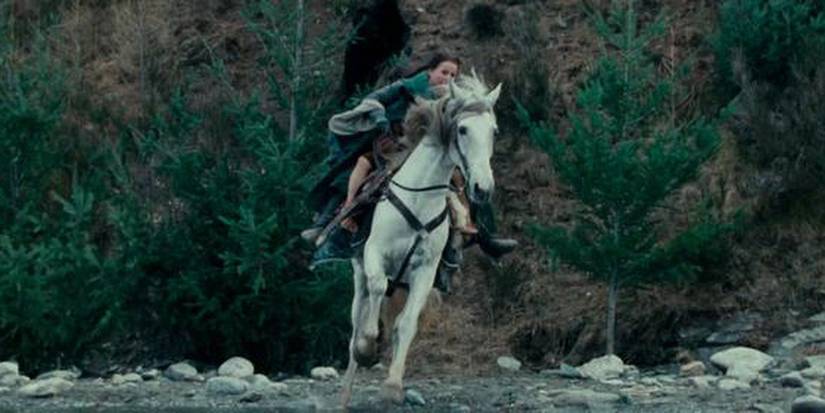 Arwen taking Frodo to Rivendell to save his life in the Lord of the Rings.