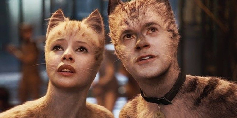 2 actors in Cats smiling at the camera