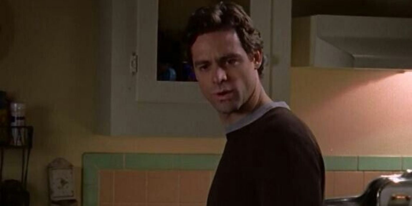 Christopher looks upset in the kitchen on Gilmore Girls