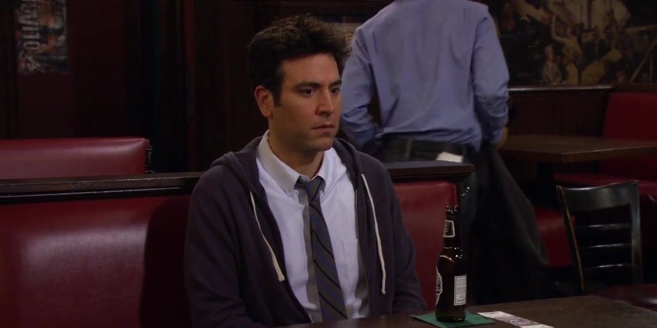 Ted sitting at McLaren's, looking upset in a scene from How I Met Your Mother.
