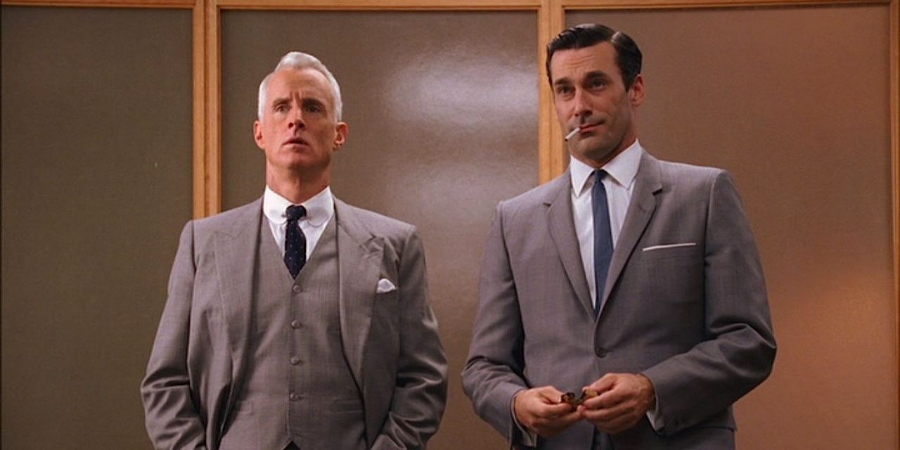 don draper and roger sterling in an elevator on mad men