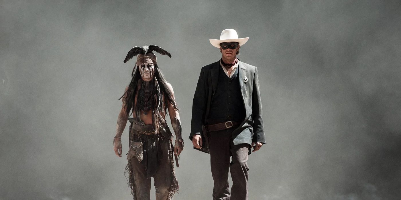 The Lone Ranger and Toto walk in front of smoke in The Lone Ranger