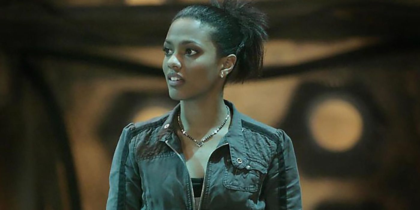 Martha Jones in Doctor Who looks off to the side.
