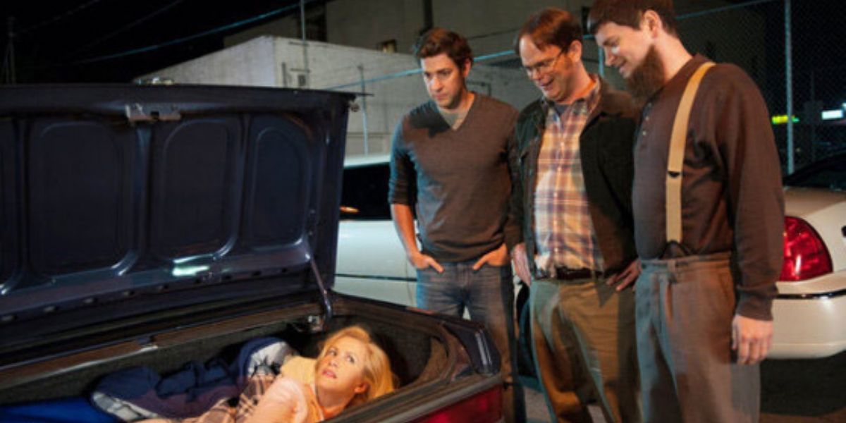 Angela in the boot of Mose's car while Jim, Dwight and Mose look on in The Office.