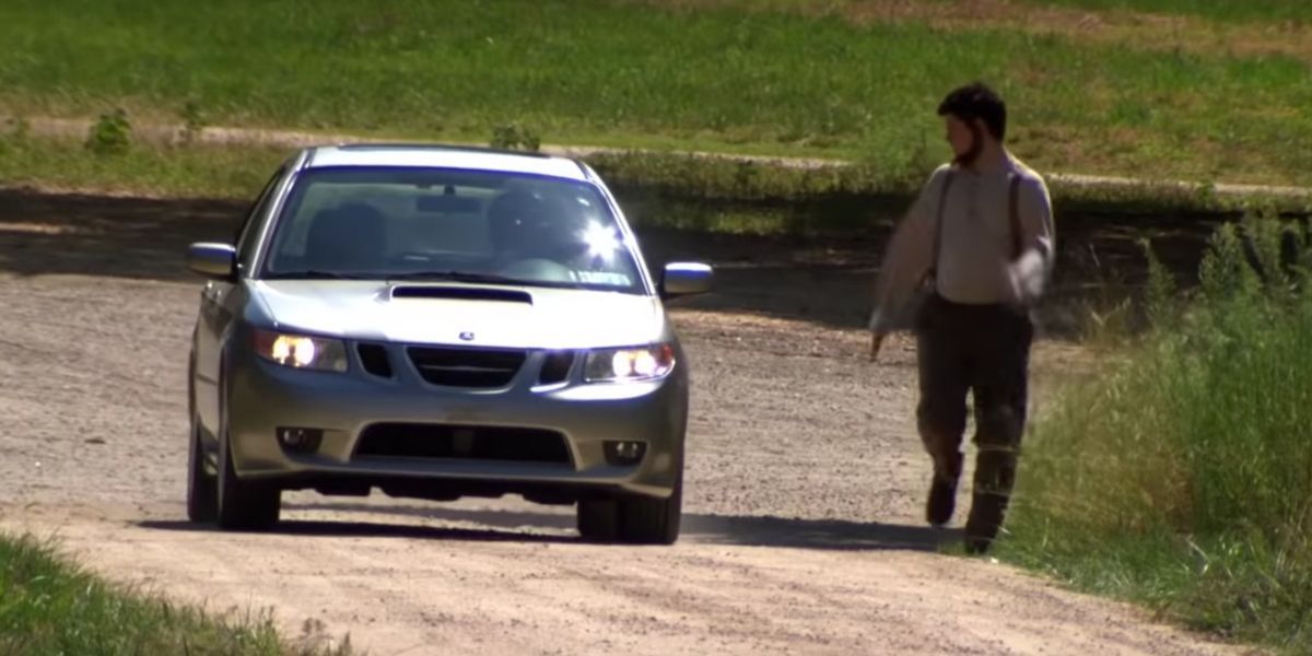 Mose runs next to Pam and Jim's car at Schrutte Farms on The Office