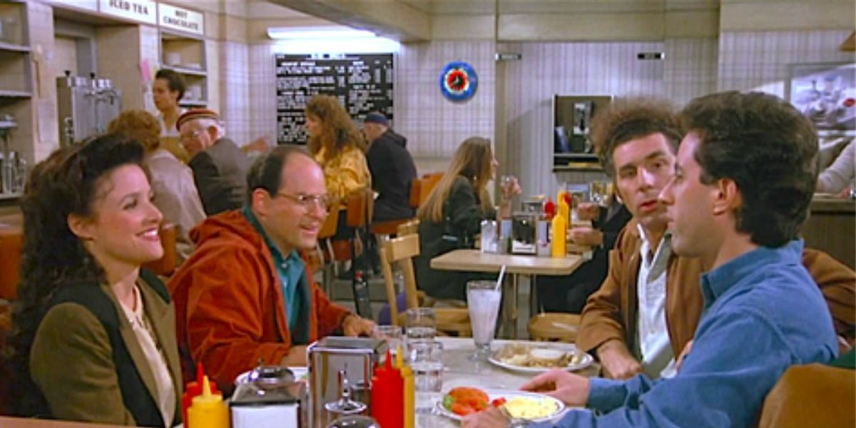 Jerry, George, Elaine &amp; Kramer talk at a diner in Seinfeld.