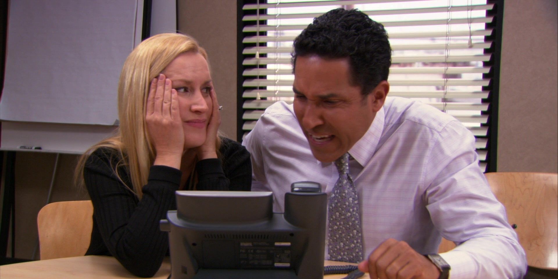 Oscar and Angela screaming into a phone in The Office.