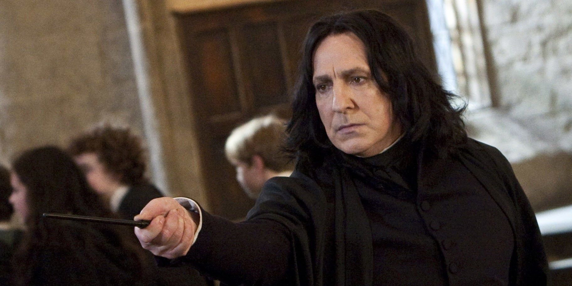 Severus Snape pointing his wans at someone