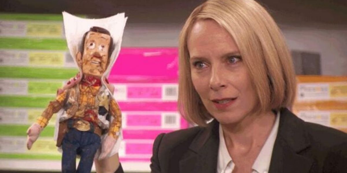 Holly holds up Woody from Toy Story on The Office