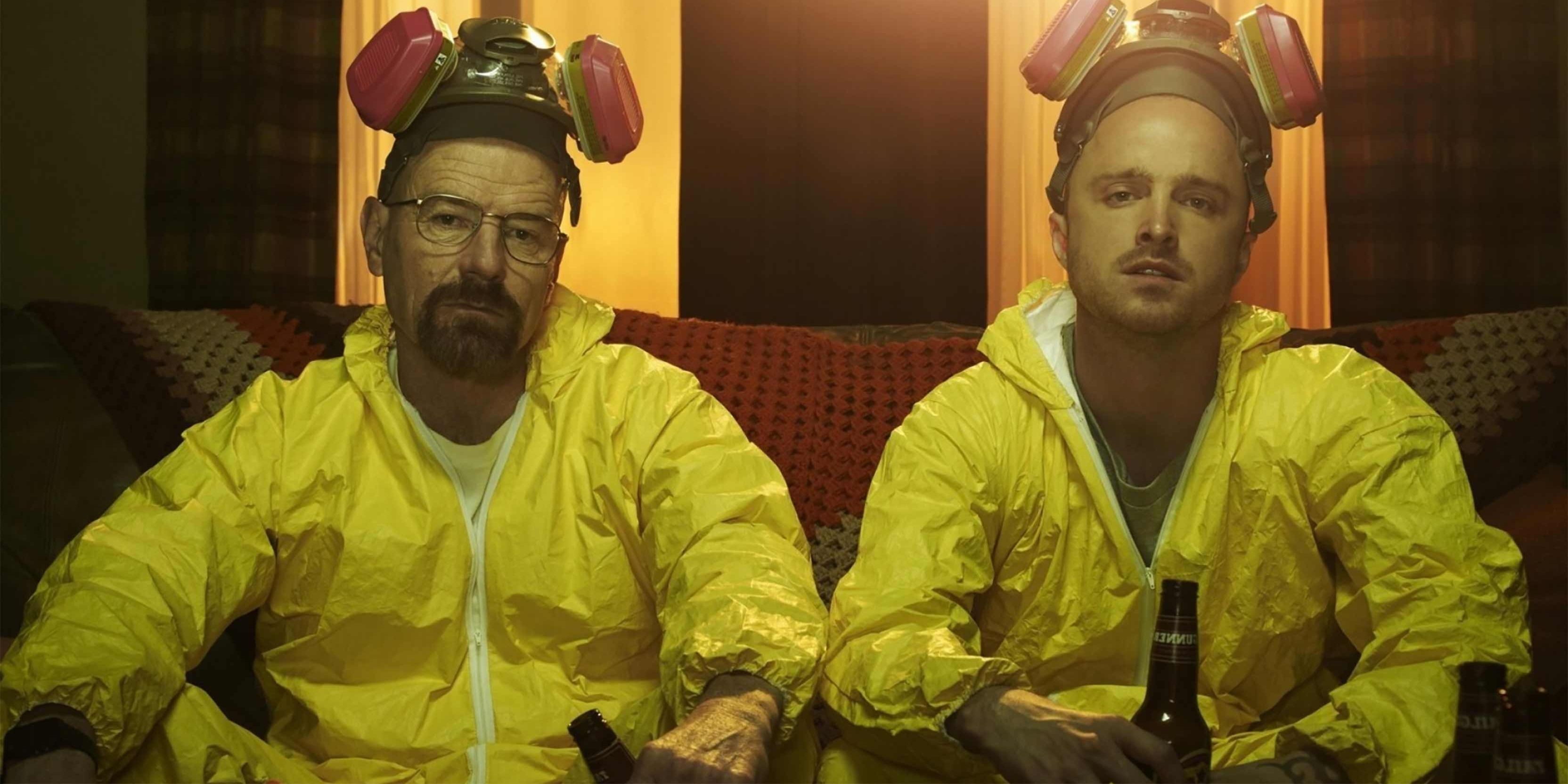 Aaron Paul and Bryan Cranston in Breaking Bad wear a yellow hazmat suit and drink beer 