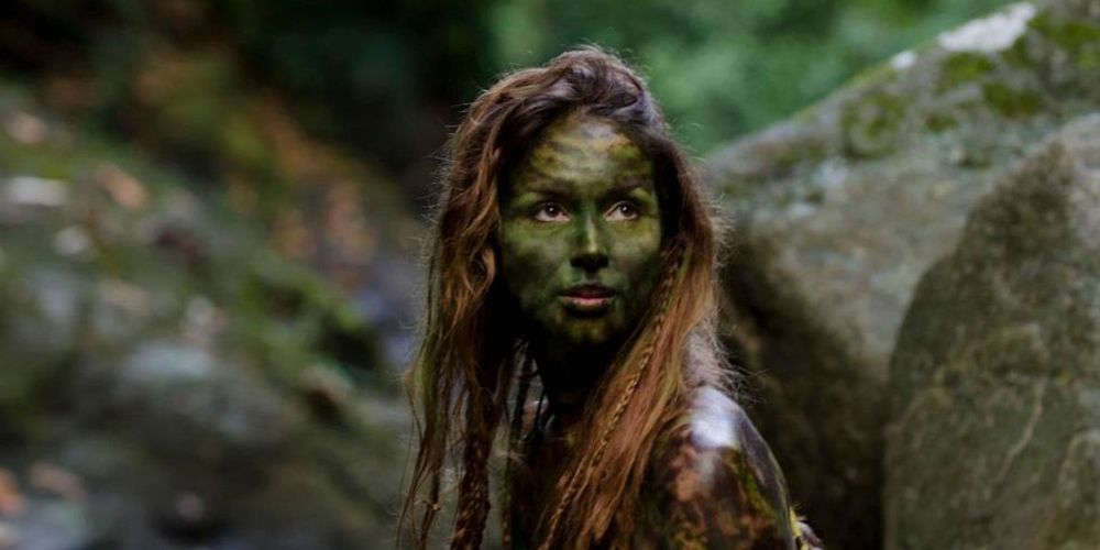 Woman with green make up on in Apocalypse Earth