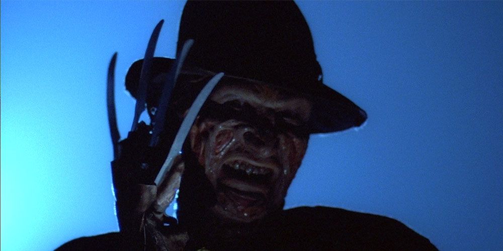 Freddy holding his glove up to his face Nightmare on Elm Street
