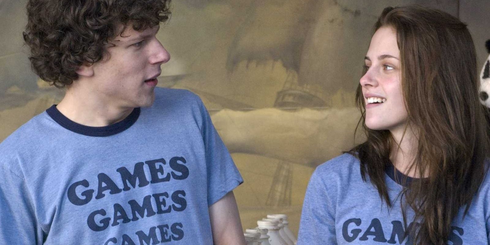 James and Em talking while wearing their Adventureland t-shirts