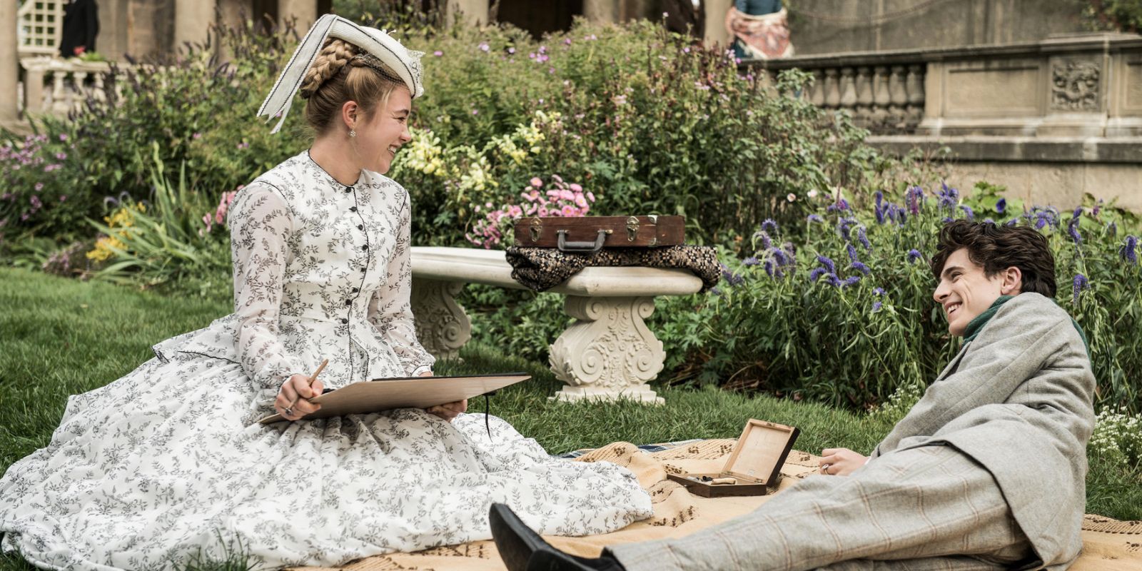 Amy and Laurie on a picnic in Little Women (2019)