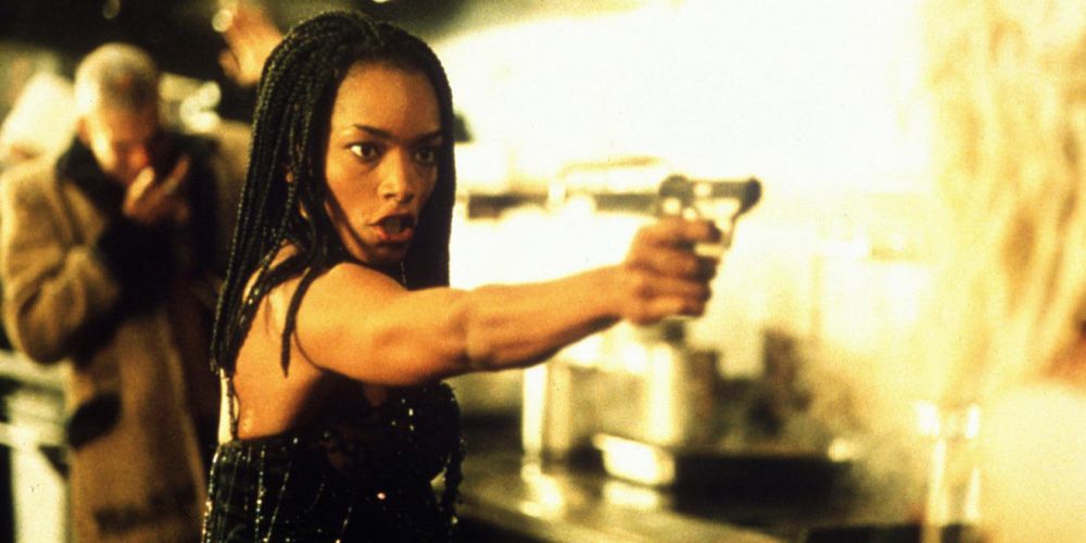 Angela Bassett aiming at someone in Strange Days