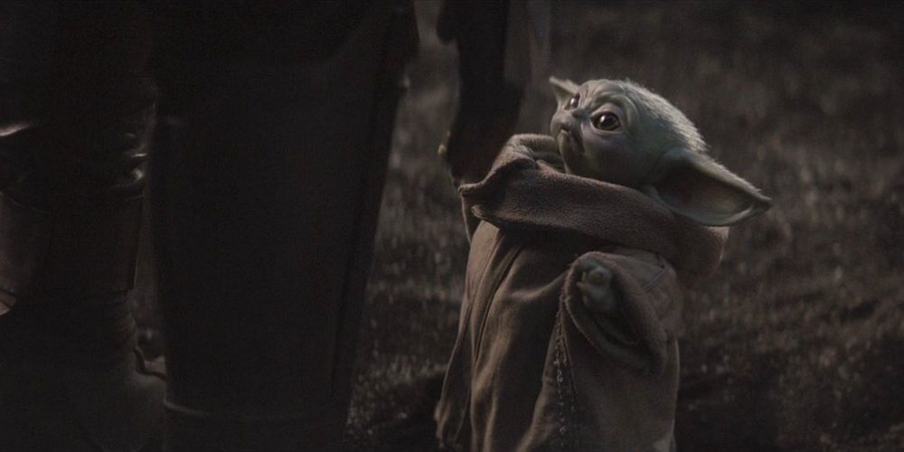 Baby Yoda wants to be picked up in The Mandalorian