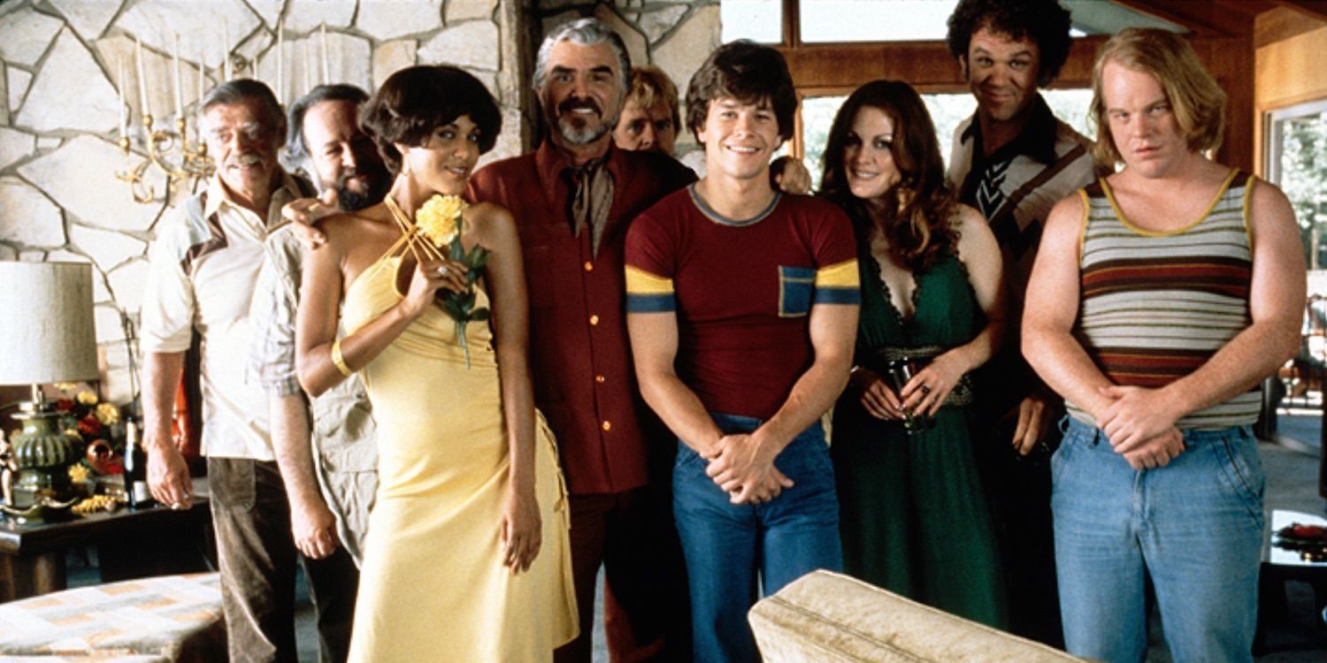 The main cast of Boogie Nights smiling for the camera