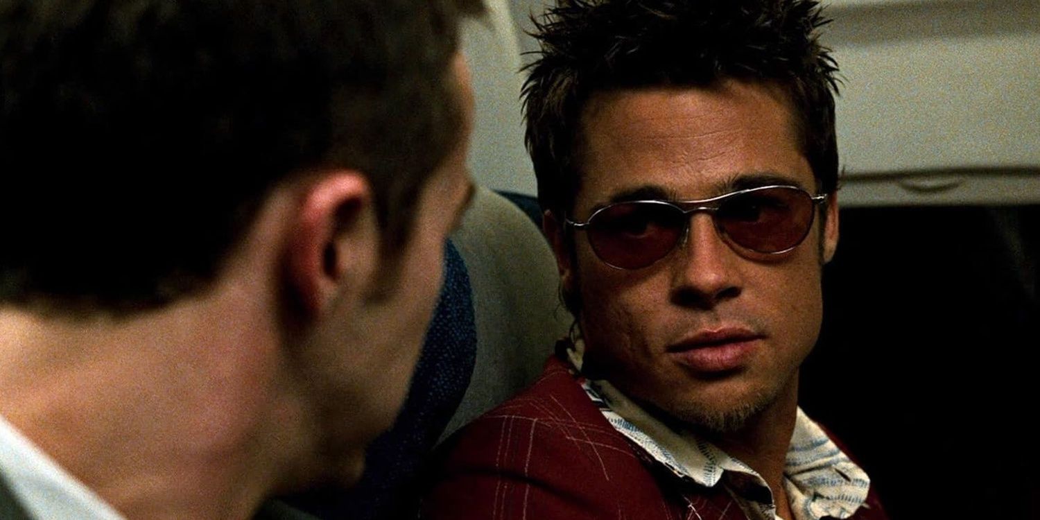 Brad Pitt wearing sunglasses on a plane in Fight Club