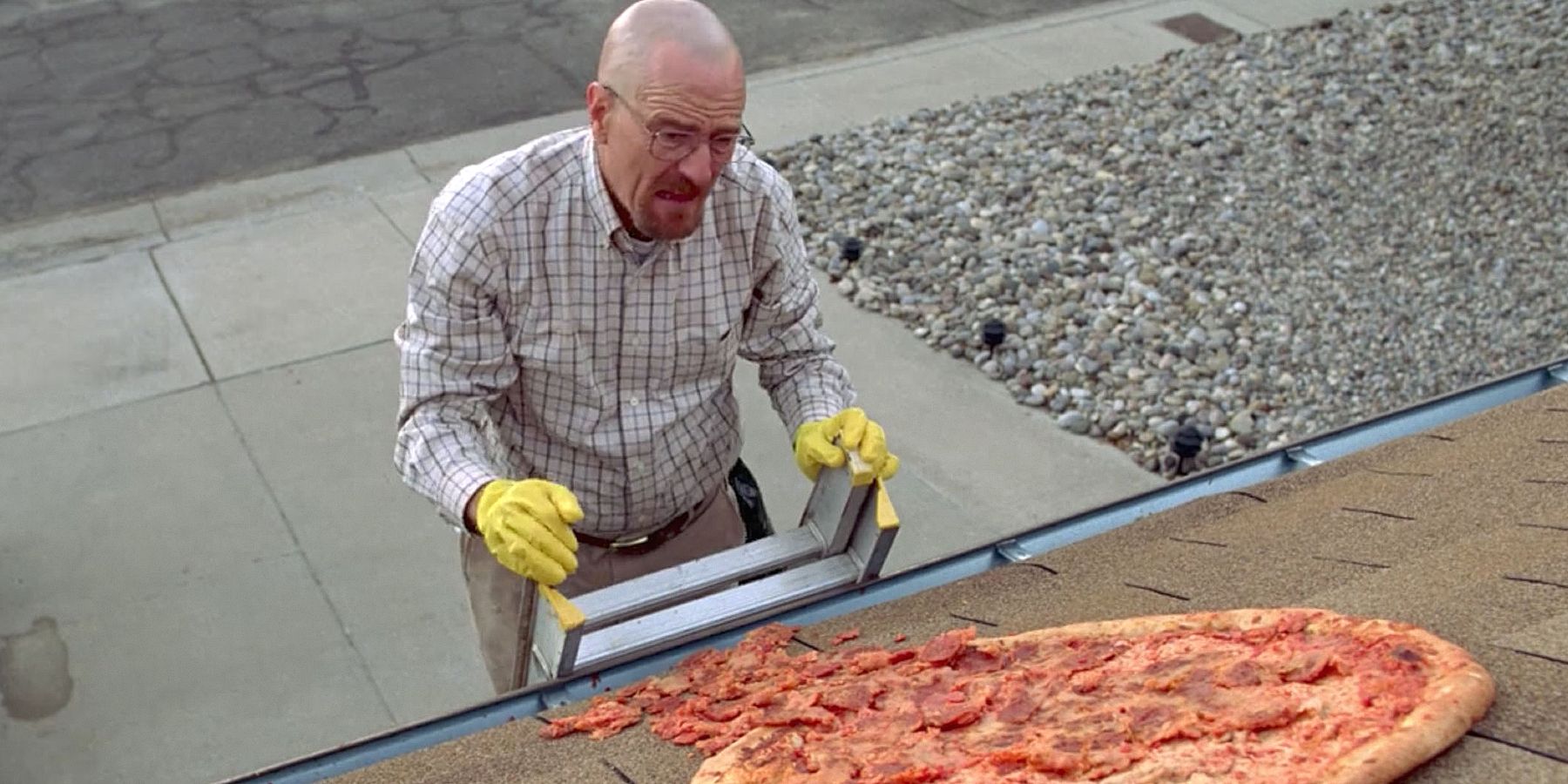 Walter White removes the pizza from the roof of his house in Breaking Bad