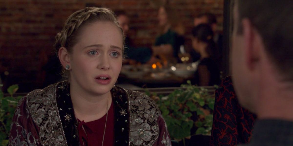 liza's daughter caitlin on tv show younger sitting in restaurant